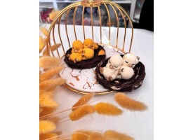 Тріо каченят на гнізді